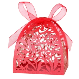 Detailed laser-cut hollow floral pattern on a red wedding favor gift box with ribbon