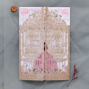 Detailed macro view of laser-cut glitter Quinceañera invitation with pink floral lining