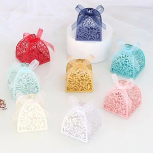 Detailed view of eight laser-cut floral gift boxes with elegant organza ribbon bows