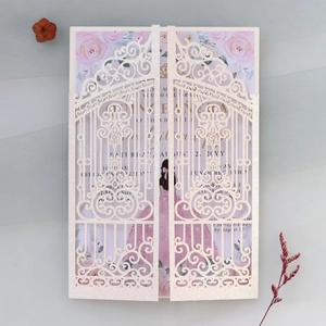 Detail of pink glitter laser-cut Quinceañera invitation with floral rose patterns