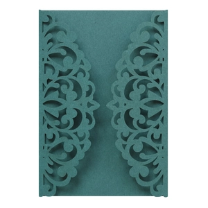 Detail of laser-cut lace pattern on a dark green pearlescent paper wedding invitation cover