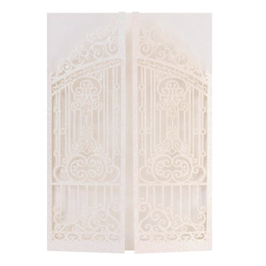 Close-up of laser-cut glitter wedding invitation with intricate gate hollow pattern