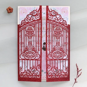 Detail of red glitter laser cut gatefold invitation with elegant floral and girl motif