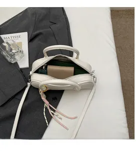 Internal view of white pebble leather handbag showing spacious storage for essentials