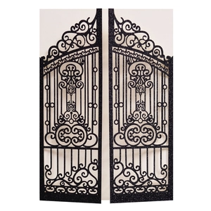 Detail of laser-cut black glitter gate wedding invitation with intricate scrollwork