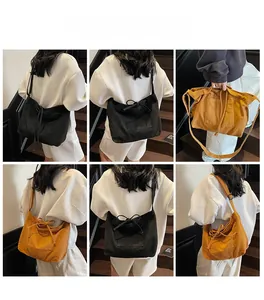 Detailed views of casual canvas tote bag with bow detail in black and mustard yellow