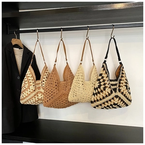 Close-up of four handmade hollow woven tote bags in various neutral colors and patterns
