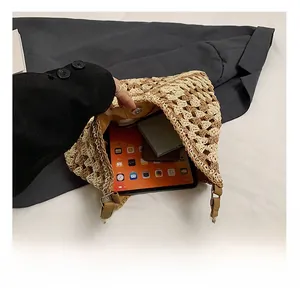 Interior view showing the spacious capacity of the two-tone crochet straw tote bag