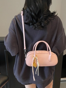 Pink lychee texture satchel handbag with top handle and shoulder strap in casual style