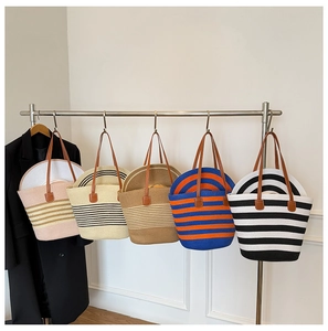 Detail view of woven straw tote bag sets with matching hats in five assorted colors