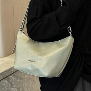 Mint green underarm hobo bag with silver chain detail and elegant metal logo