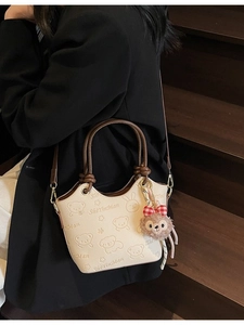 Vintage beige bucket bag with cute bear embossing and ShellieMay plush charm detail