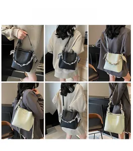 Collage of model wearing minimalist bucket bag in black and mint green with scarf strap