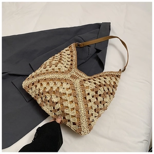 Detail of hand-woven crochet shoulder bag featuring retro beige and brown patchwork texture