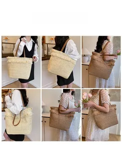 Detailed views of the large straw tote bag with fringe trim and faux leather straps