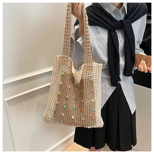 Handmade crochet hollow tote bag with colorful pearls and wide woven shoulder strap