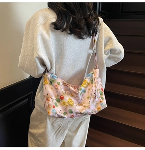 Detail of light pink shoulder bag with 3D cute cartoon bear and flower crochet print
