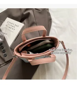 Interior view of pink bucket bag showing large capacity, zip pocket and glitter details
