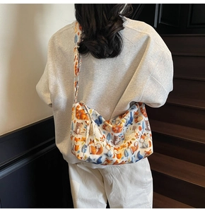 Rear view of model wearing the cartoon forest animal print canvas tote bag on stairs
