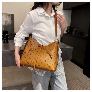 Detail of vintage brown shoulder bag with bear print pattern and drawstring knot