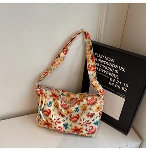 Detailed view of the colorful cartoon canvas tote bag with vibrant prints and wide strap