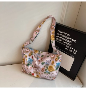 Detail of pink nylon tote bag with 3D cartoon bear, rabbit, and colorful floral accents