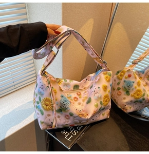 Detail of pink canvas tote with 3D crochet bear print and adjustable wide strap