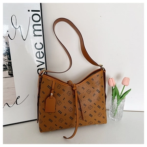 Close-up of brown pebbled leather texture with bear prints and drawstring detail