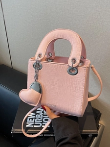 Pink lychee texture leather handbag with heart charm and detachable shoulder strap