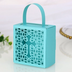 Detail of laser-cut cross hollow gift box in tiffany blue with handle and lace pattern