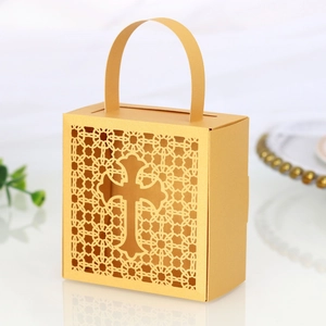Detailed laser-cut hollow cross gift box with elegant lace patterns and integrated handle