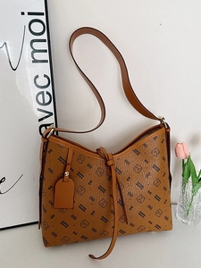 Vintage brown leather shoulder bag with bear pattern and adjustable straps