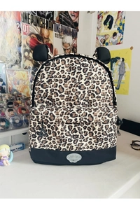Detail view of leopard print backpack with cute animal ears and durable black bottom base