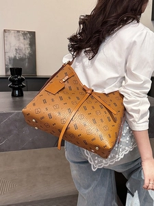 Retro tan leather tote bag with bear print and large capacity shown in a modern interior
