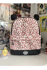 Detail of leopard print backpack with 3D animal ears and metallic G-XD brand logo