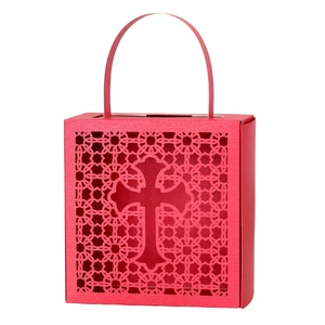 Close-up of red laser-cut candy box with hollow cross and floral lace patterns