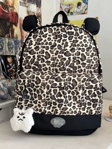 Leopard print backpack with bear ears, black contrast base and plush star pendant charm