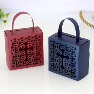 Macro shot of cross hollow-out gift boxes in burgundy and navy blue colors