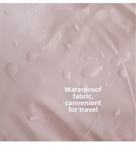 Macro detail of waterproof pale pink fabric with clear water droplets on the surface