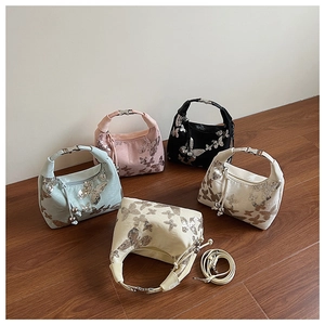 Detailed collection of five sequined hobo bags featuring butterfly patterns in various colors