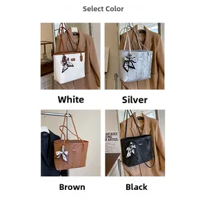 Detail of four faux snakeskin tote bags in white, silver, brown and black with silk scarves
