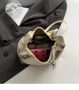 Top view of the spacious inner compartment of this sequined butterfly shoulder bag