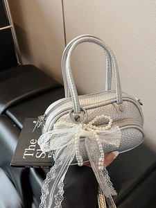 Silver metallic mini bowling bag with pearl lace bow and pebbled leather texture