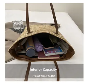 Internal view of a large straw tote bag showing ample space for daily essentials