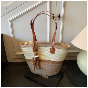 Detailed weave texture of contrast stitching tote bag with a cute rabbit charm