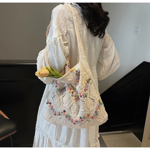 Detail of hollow-out crochet tote bag featuring vibrant beads and bohemian texture