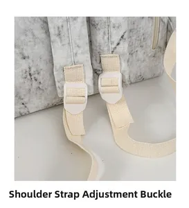 Detail view of durable white plastic shoulder strap adjustment buckle and woven strap