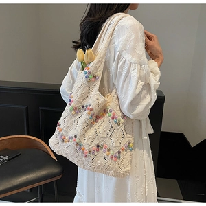 Detail of crochet tote bag with colorful beads showing the woven texture and large capacity