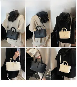 Litchi pattern mini tote bag shown in multiple carrying styles on a model in black and cream