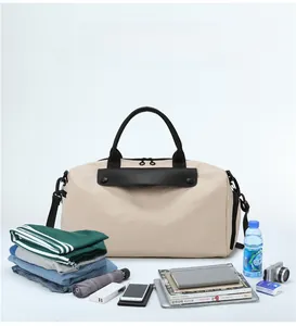 Detail showing high-capacity travel bag with organized items on a minimalist background